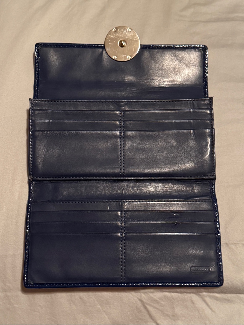 A Coach Plaid Trifold Wallet with Decorative Silver Signature Medallion - Picture 4 of 11